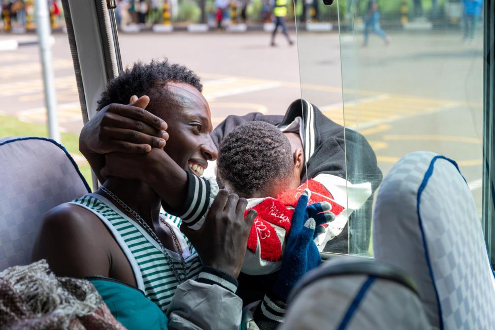 One of the refugees departing for Canada embraces family and friends prior to leaving. Photo: IOM 2023/ Robert Kovacs