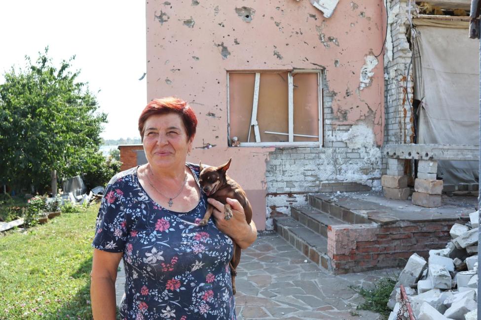 With IOM’s assistance, Nina’s family was able to repair the roof of her house that was damaged by shelling. Photo: IOM/Anastasiia Rudnieva 