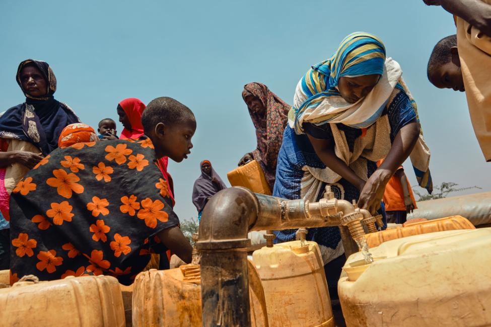 Water trucking activity in Dollow internal displacement site. Photo: IOM/Claudia Rosel