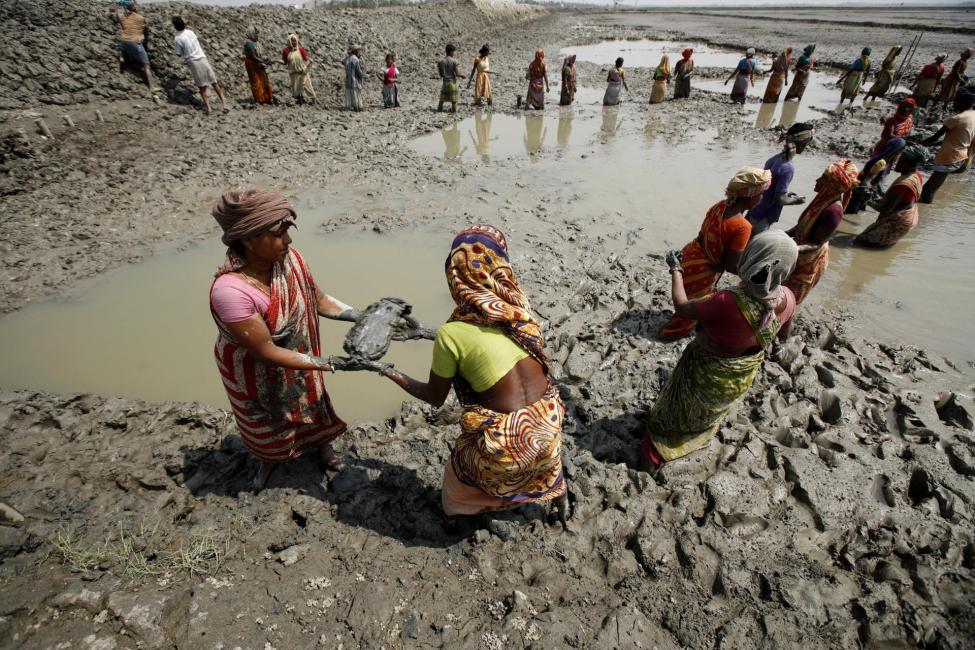 Women work to rebuild an embankment in one of the regions hit by Cyclone Aila in Dacope, Khulna Bangladesh. Photo IOM/ Abir Abdullah 